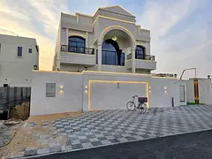 Villa for sale in Al Helio 2, Ajman. 5 master bedrooms, majlis, living room with kitchen, maid's roo