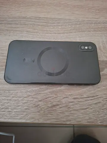Used iPhone X/XS with MagSafe-style protective case - Good condition, small crack on back side