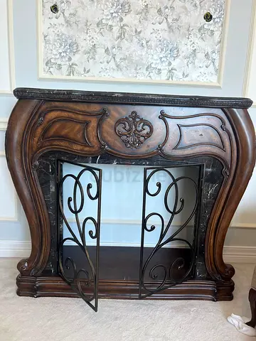 Ornate Wooden Console Table with Iron Scroll Doors