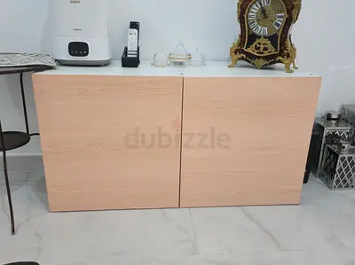 Low wooden storage cabinet with white top - good condition