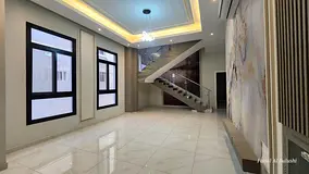 For rent in Al Yasmin, a commercial villa with 5 master bedrooms, a majlis, a living room, a kitchen