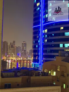 Sharjah, Al Majaz 3, furnished apartment, two bedrooms, living room, kitchen, two bathrooms, and bal