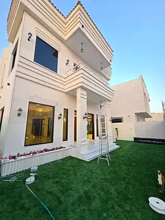 Villa for sale in Al Amrah, Ajman. 4 master bedrooms, 2 living rooms, a majlis, and a large equipped