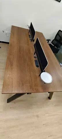 Double workstation desk - wooden top with monitor stands, used