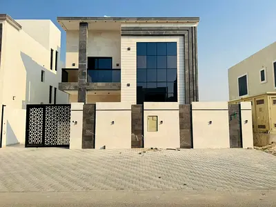 For sale in Al Amrah area, Ajman: a villa with 6 master bedrooms, a majlis, a living room, and a maid's room.