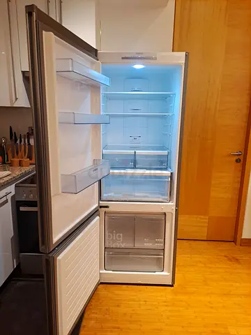 Large double-door refrigerator with freezer compartment - good condition
