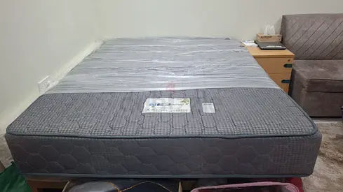 Almost-new queen mattress, firm support, grey