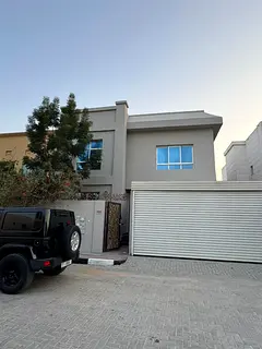 For rent in Al Zameela, Ajman: a villa with 5 master bedrooms, a majlis, a living room, a kitchen, a