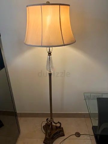 Classic floor lamp with fabric shade and decorative base foot on/off button