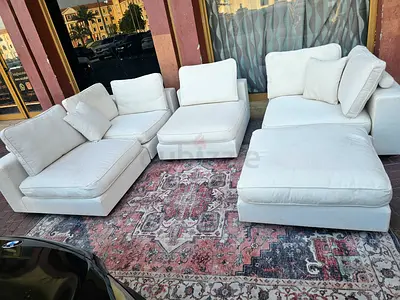Modular feather filled sofa with footstool