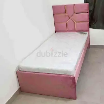 Single Pink Upholstered Bed with Headboard and Mattress