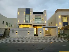 For sale in Al Helio 2, Ajman: a villa with 5 master bedrooms, a majlis, a living room, a spacious k