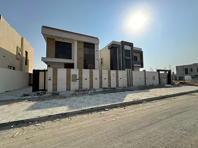 Villa for sale in Al Helio 2, directly opposite Al Zahya, 4 master bedrooms, a living room, a spacious kitchen, and a maid's room