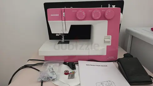 Janome Compact Sewing Machine with Foot Pedal and Accessories - Pink/White