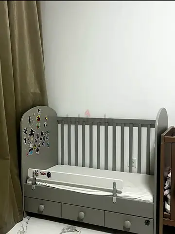 Convertible baby crib with storage drawers — grey, gently used