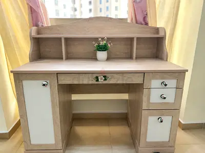 Oak and Pink study desk with pink chair and a bed side table