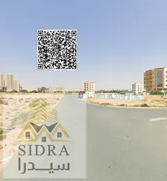 * Residential commercial land for sale in Global City Al Alia in a prime and strategic location clos