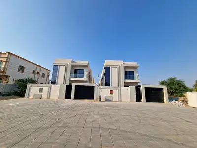 Villa for sale in Al Muwaihat 2, Ajman. 5 master bedrooms, majlis, living room with kitchen and maid's room.