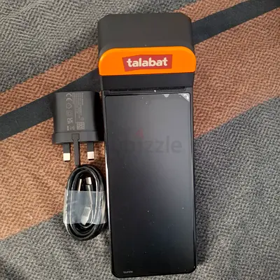 Used Android smartphone with charger — includes Talabat order recived pos machine