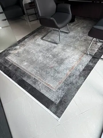 Modern grey rectangular area rug with bordered design - excellent condition