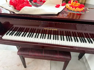 Used glossy upright Huyndei (Hyundai?) piano with bench - good condition