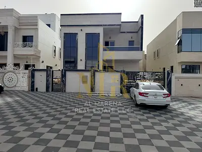 Villa for sale, freehold, open to all nationalities, near Sheikh Mohammed Bin Zayed Road, including registration and ownership fees.