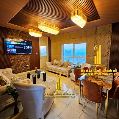 Luxurious two-bedroom apartment with a living room, fully furnished, and featuring a balcony with sea views. Ajman, Orient Tower.