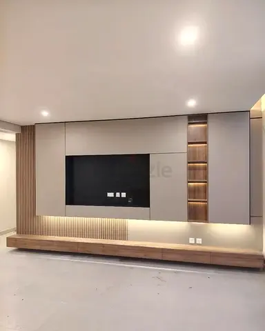 Modern Wall-mounted Entertainment Unit with Integrated Shelving and LED Lighting
