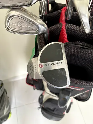 Set of used golf clubs with Odyssey White Hot putter (in bag)