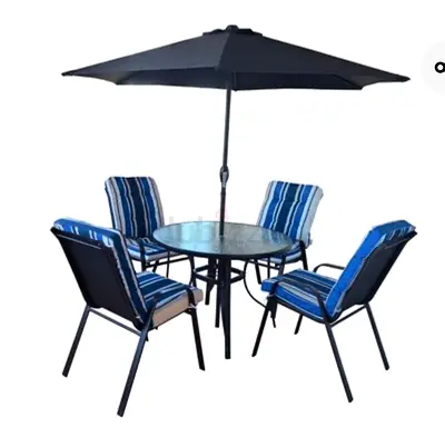 Description For Sale: Round Glass-Top Table Set  Includes: Four cushioned chairs and an unused umbre