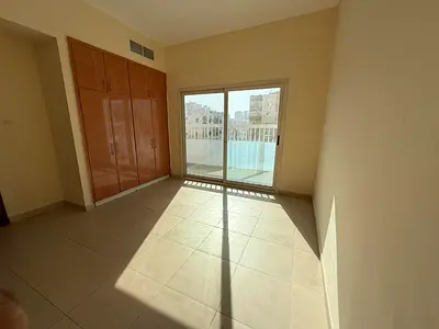 2BR with Balcony & Built-in Wardrobes | Direct Exit to Dubai | Abu Shagara