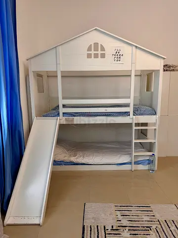 White bunk bed with the slide
