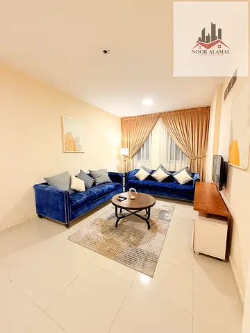 Sharjah, Al Majaz 3: Super deluxe furnished apartment with one bedroom, living room, kitchen, bathroom, and balcony.