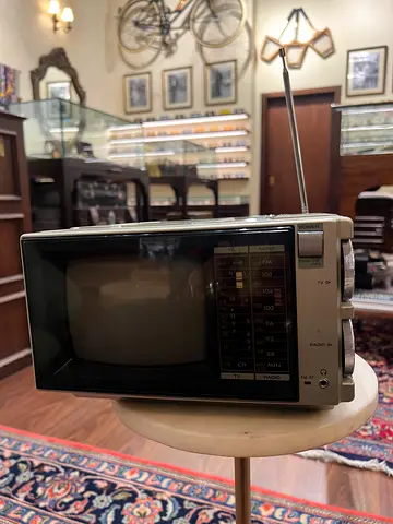 Vintage portable CRT TV radio combo with antenna