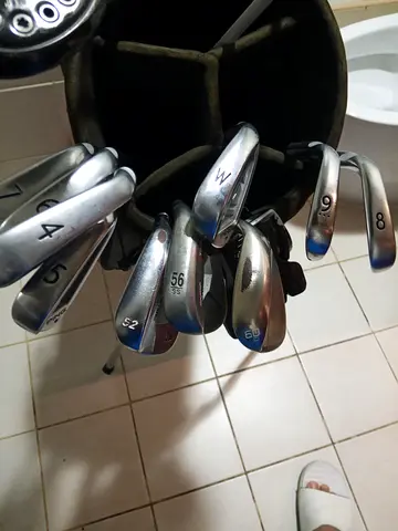 Used set of golf irons and wedges in stand bag - good condition