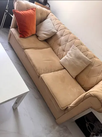Beige Tufted Three-Seater Sofa with Cushions - Good Condition