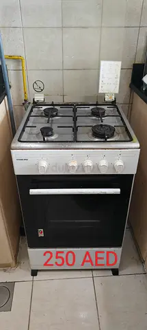 4-Burner Gas Stove with Oven - Good Working Condition (250 AED)