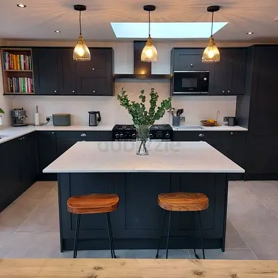 Modern dark grey kitchen with island and pendant lights - complete cabinetry set