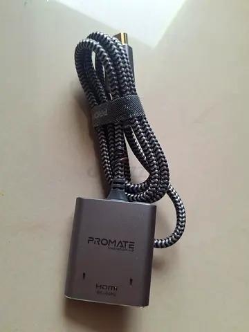 Promate MediaSplit-H2 4K HDMI splitter with dual HDMI ports and a braided cable.