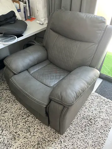 Grey leather recliner armchair in great condition.