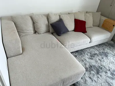 Light beige L-shaped sofa with chaise - comfortable, good condition