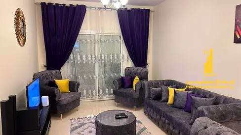 Luxury one-bedroom apartment with a balcony and open views. Ajman, Orient Tower. Fully furnished, available for monthly rent.
