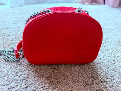 Lacoste - Small red leather crossbody bag with chain strap - gently used