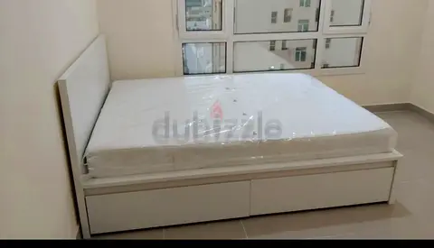 Ikea Queen size bed with mattress underneath 2 storage drawers available in perfect condition