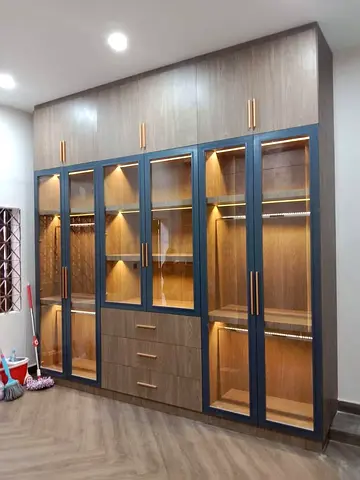 Large Built-in Wooden Wardrobe with Glass Display Doors and LED Lighting