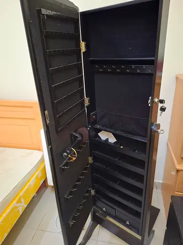 Tall Black Lockable Jewelry Armoire with Mirror and Multiple Compartments