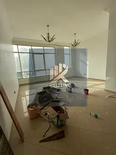 The most beautiful and best three-bedroom apartment with a living room in the Al Taawun area of ​