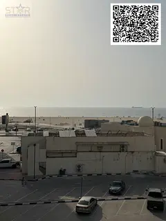 One-bedroom apartment with a living room, two bathrooms, and a balcony for annual rent in Ajman Corn