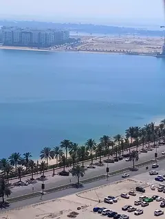 Direct Al Khan Corniche view + separate kitchen + gym, spacious family studio with central AC in a p