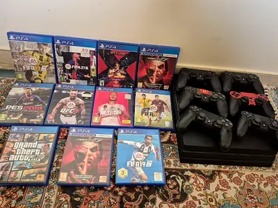 PlayStation 4 with 4 Controllers and 12 Games (Good Working Condition)